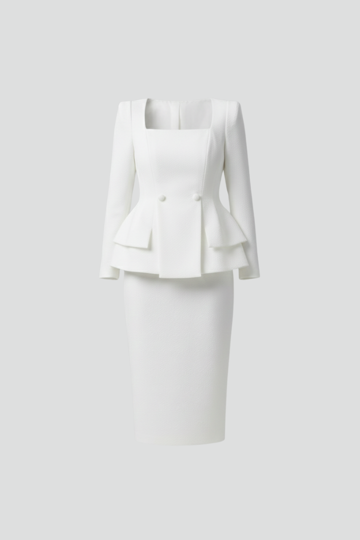 White two-piece set laid flat, showing the square neckline, two buttons and layered peplum jacket with matching skirt.