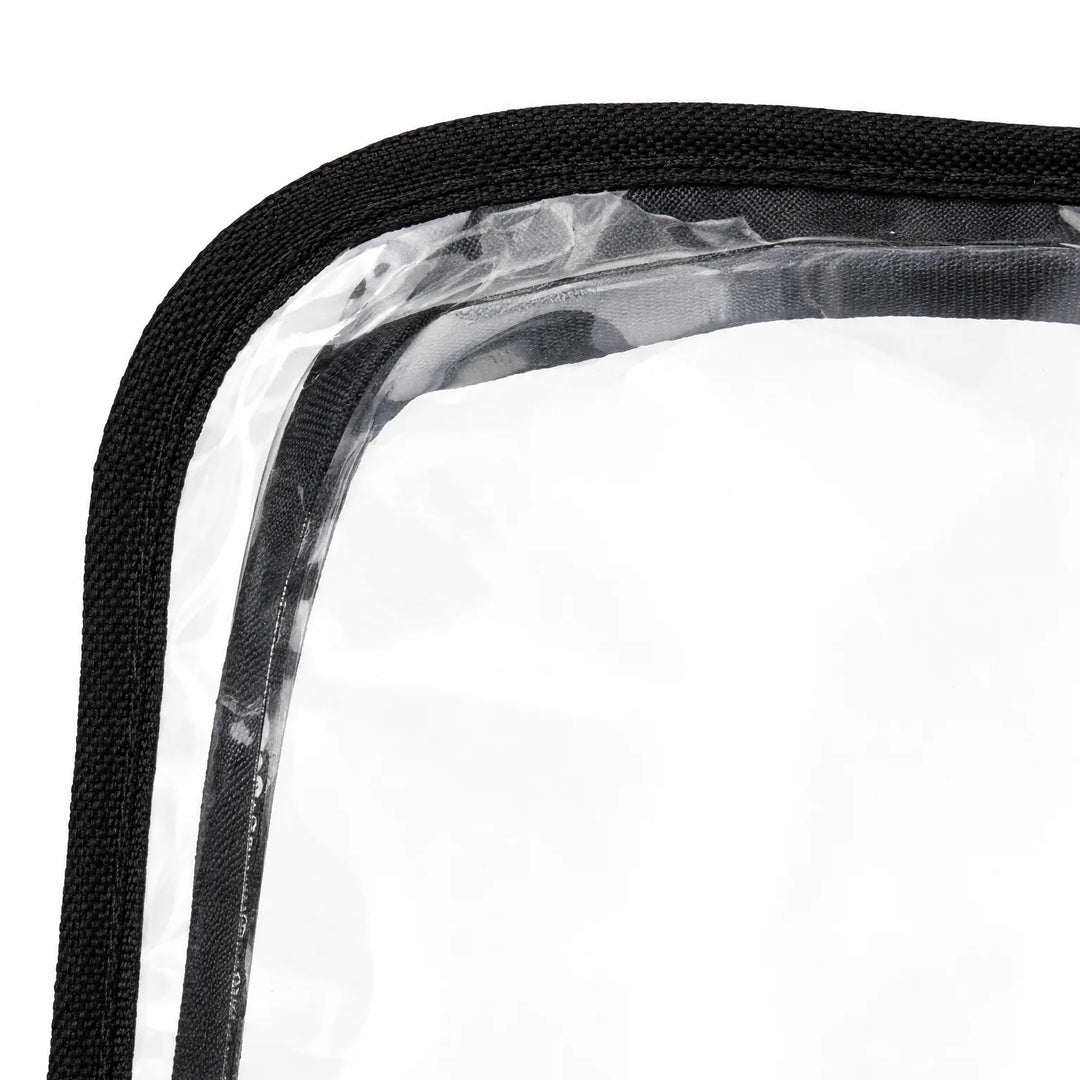 Close-up of a muff corner showing the woven black fabric binding along the edge of the transparent plastic panel. 5