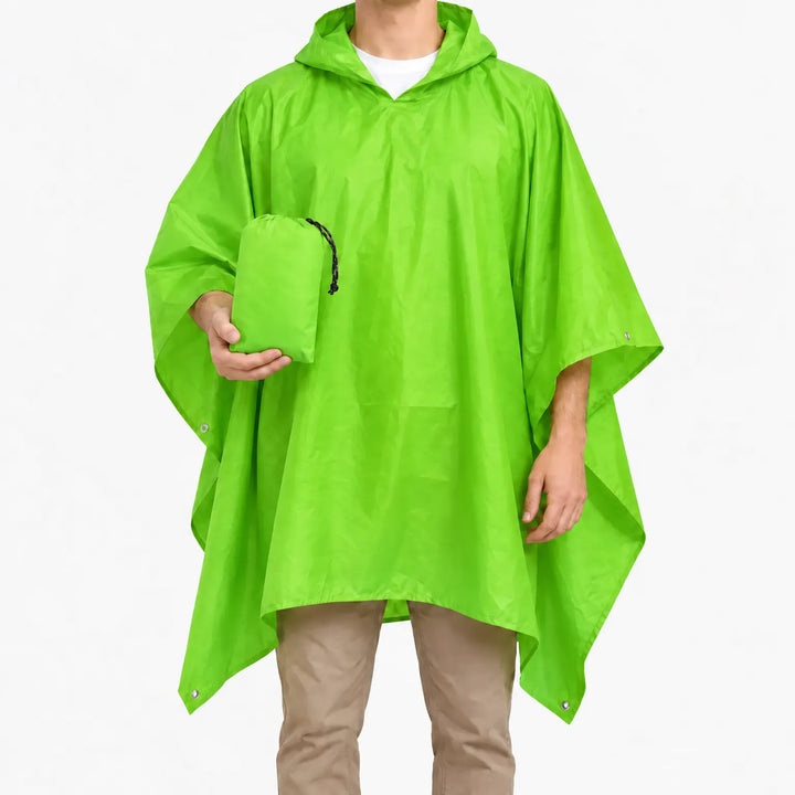 Man in the bright green version of the hooded poncho, holding the matching green drawstring pouch against a white background. 7