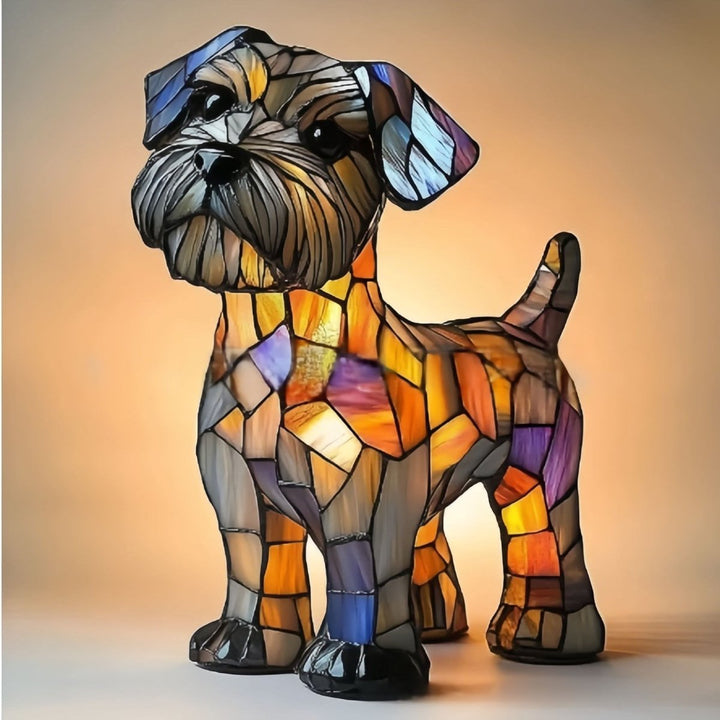 Glowing stained-glass-style terrier lamp with a shaggy gray face, tilted head and upright tail, glowing orange, purple and blue against a warm backdrop. 21