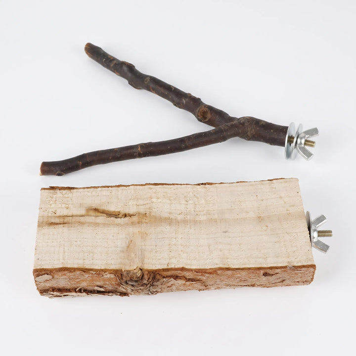 Overhead flat lay of the forked branch perch and the rough wooden block perch, both with metal wing nuts and washers. 4