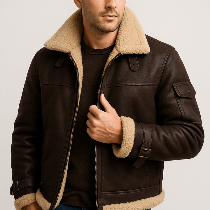 Dark brown leather jacket with shearling collar, sleeve pocket and cuff straps, worn over a dark sweater 8