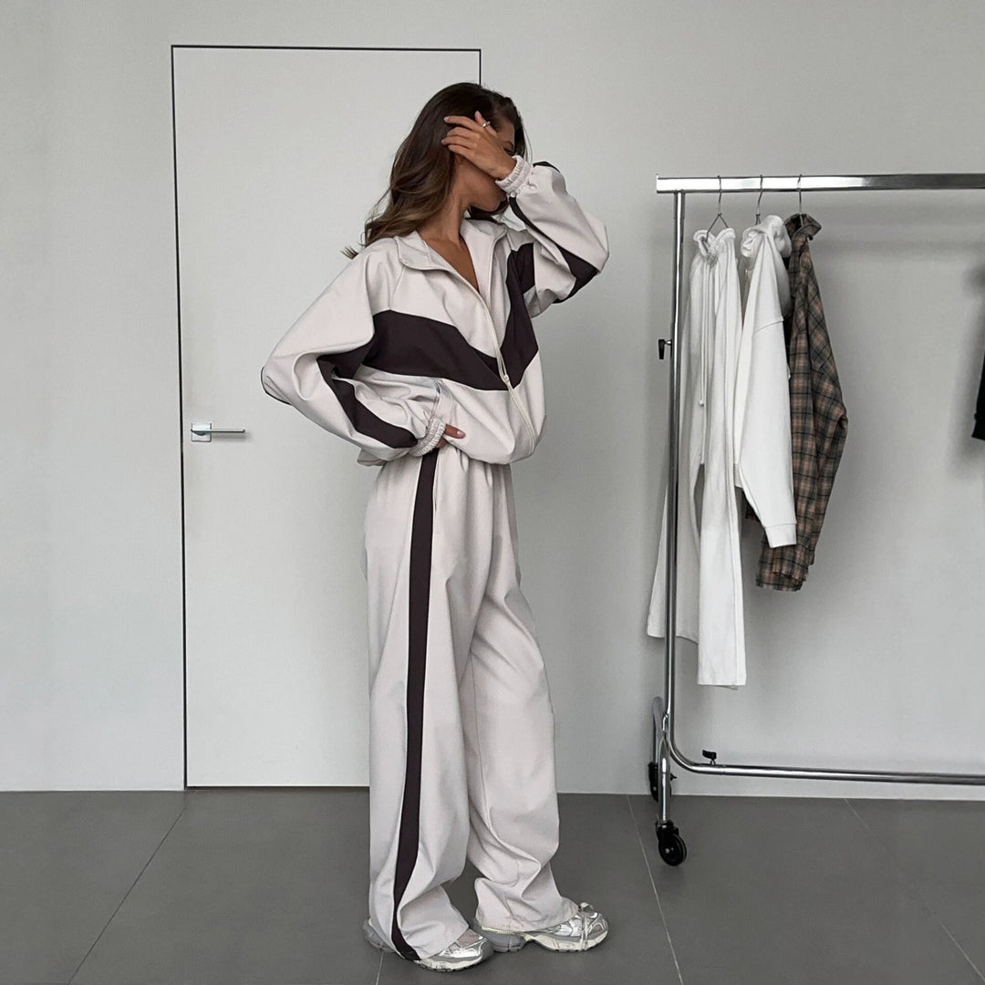 Women's windbreaker tracksuit set in cream and dark brown, another view of the wide-leg pants side detail.
