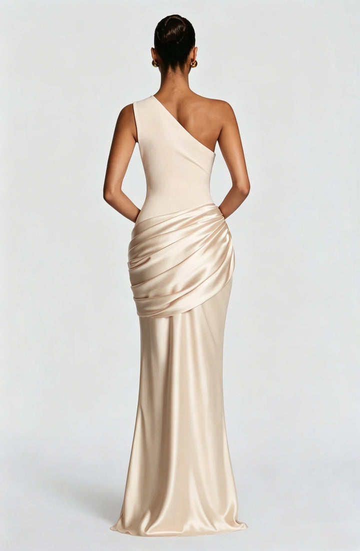 Back view of the cream one-shoulder maxi dress, showing the asymmetric neckline, plain fitted back and draped satin hip. 29