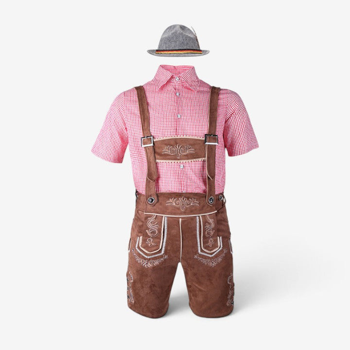 Men's Bavarian costume set with brown lederhosen, a red gingham shirt and a gray feathered hat, flat lay.