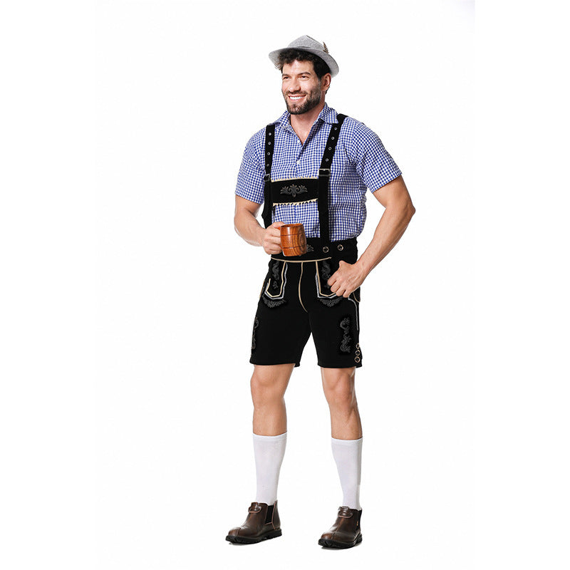 Men's Bavarian costume set with black lederhosen, a blue checked shirt and a gray hat on a model.