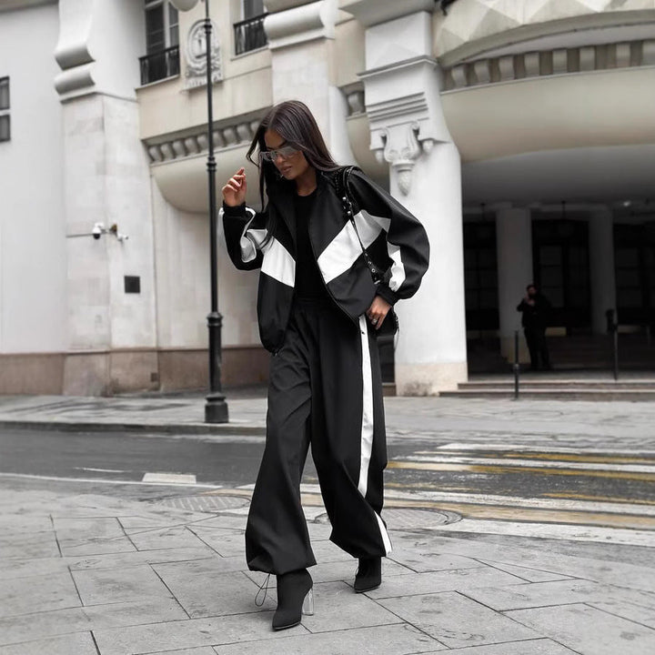 Women's windbreaker tracksuit set in black and white, another view of the jacket and wide-leg pants.
