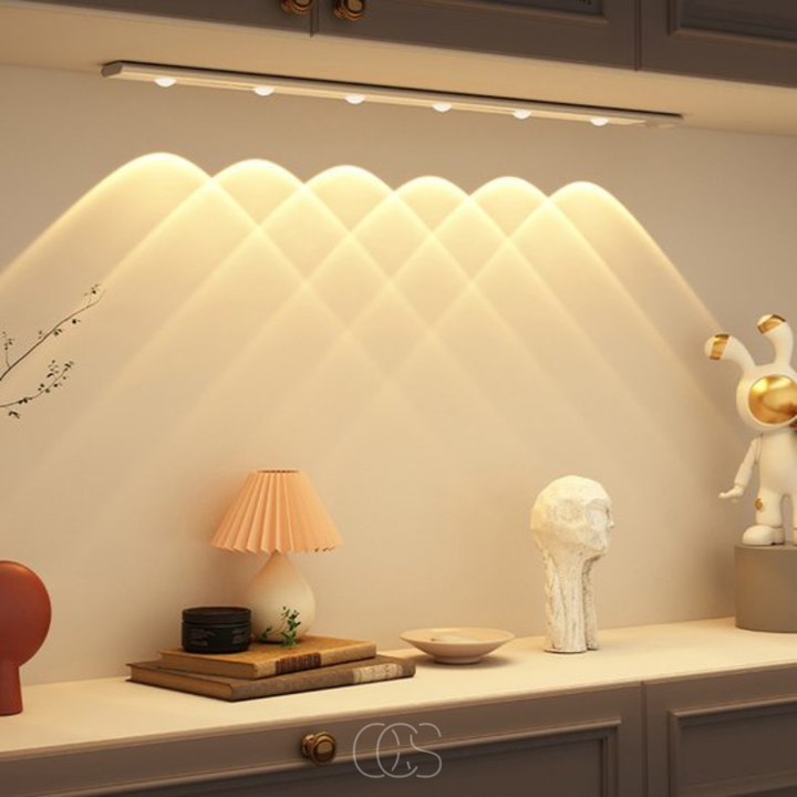 Wireless LED Closet Light with Motion Sensor in silver under a cabinet with warm light