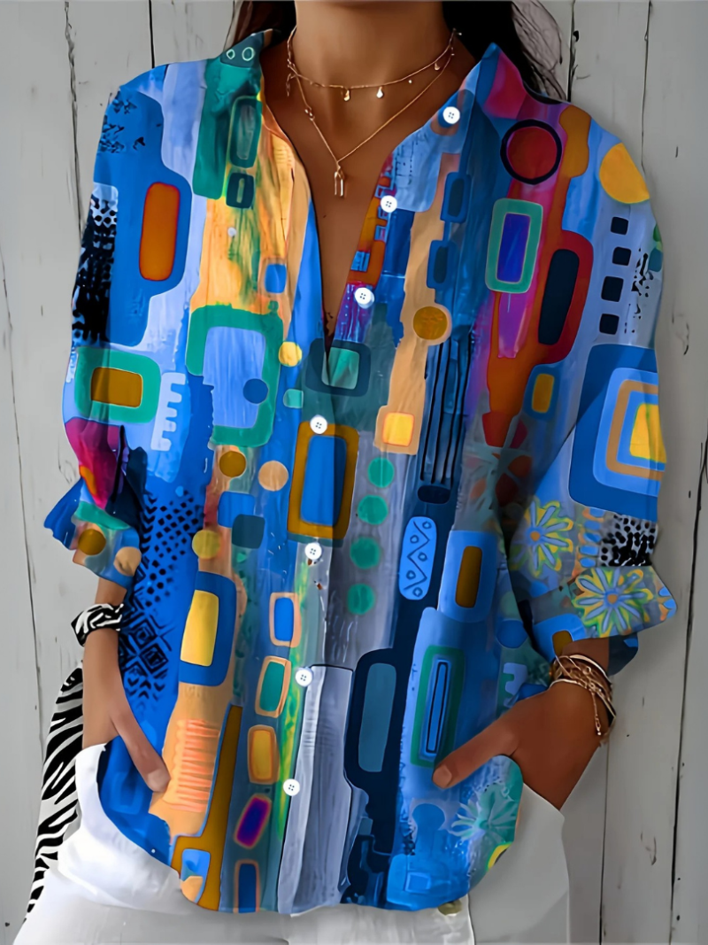 Close-up front view of the blue colorway, showing the painterly rectangles, dots and floral motifs.