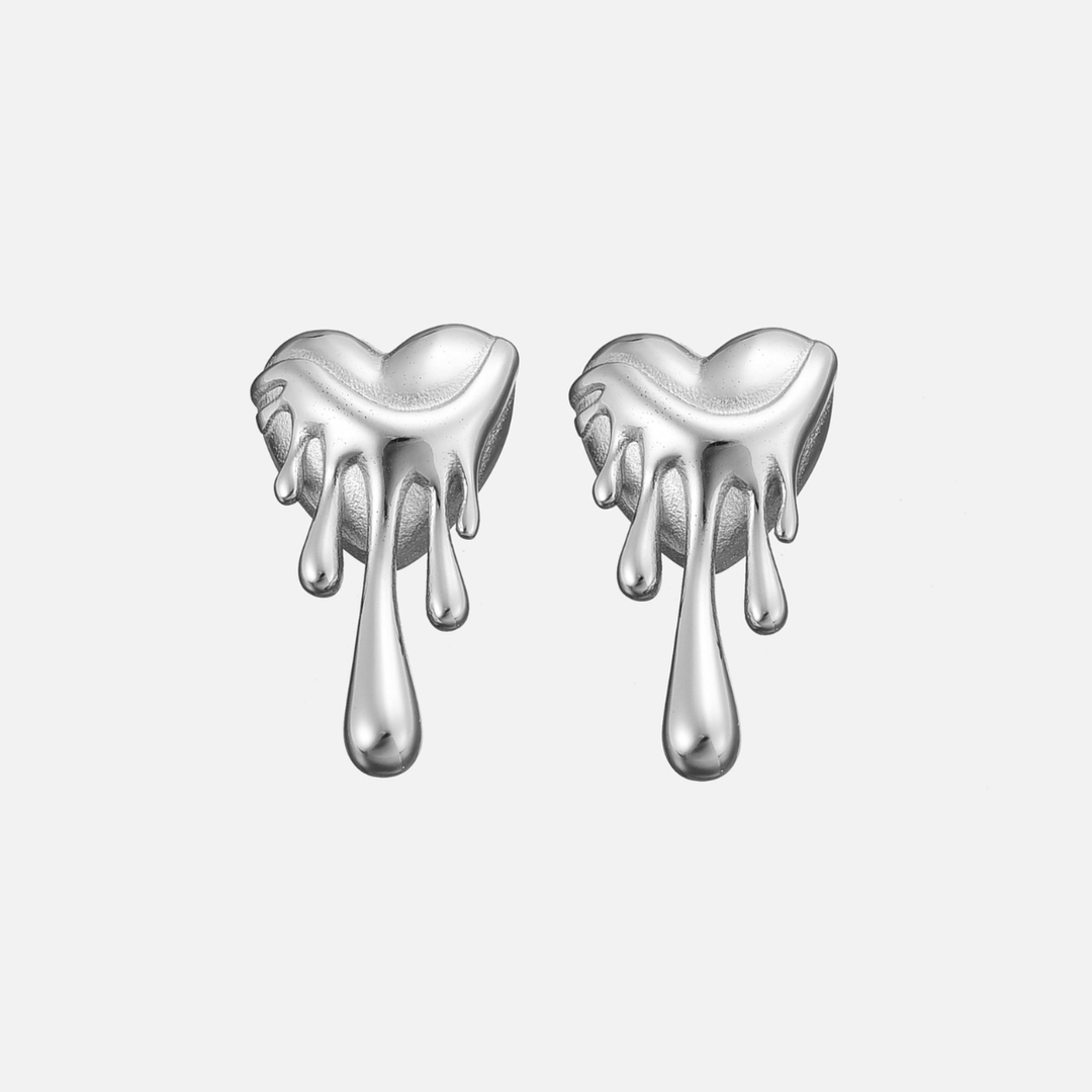 Pair of silver-tone heart stud earrings with long melted drips, front view on a light background 3