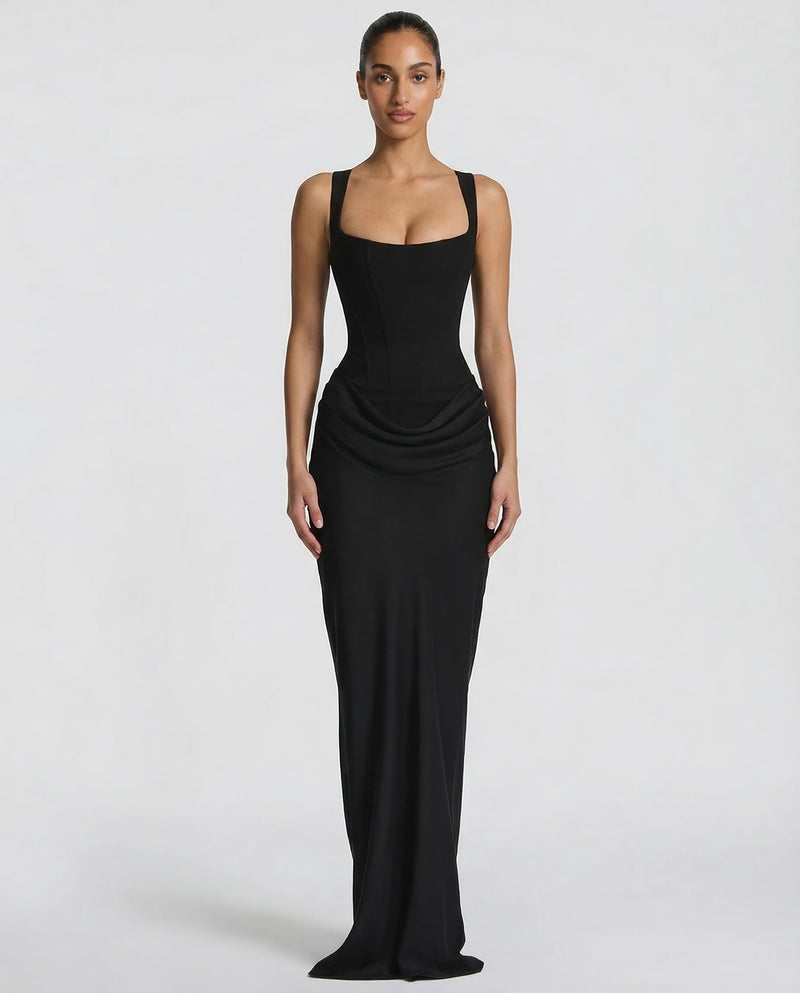 Black maxi dress with a square-neck corset bodice and draped hip detail, front view.