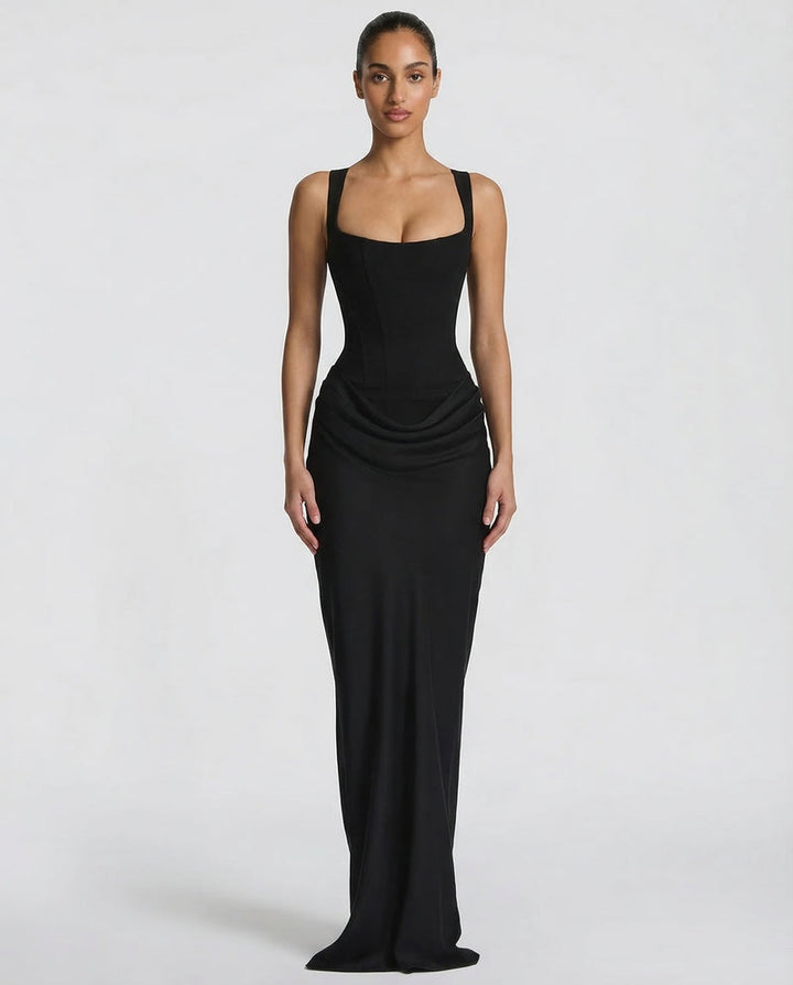 Black maxi dress with a square-neck corset bodice and draped hip detail, front view.