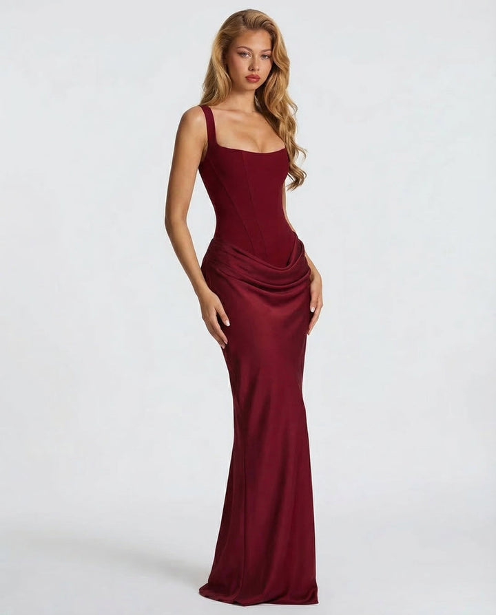 Burgundy maxi dress another view with a draped hip detail and flared hem.