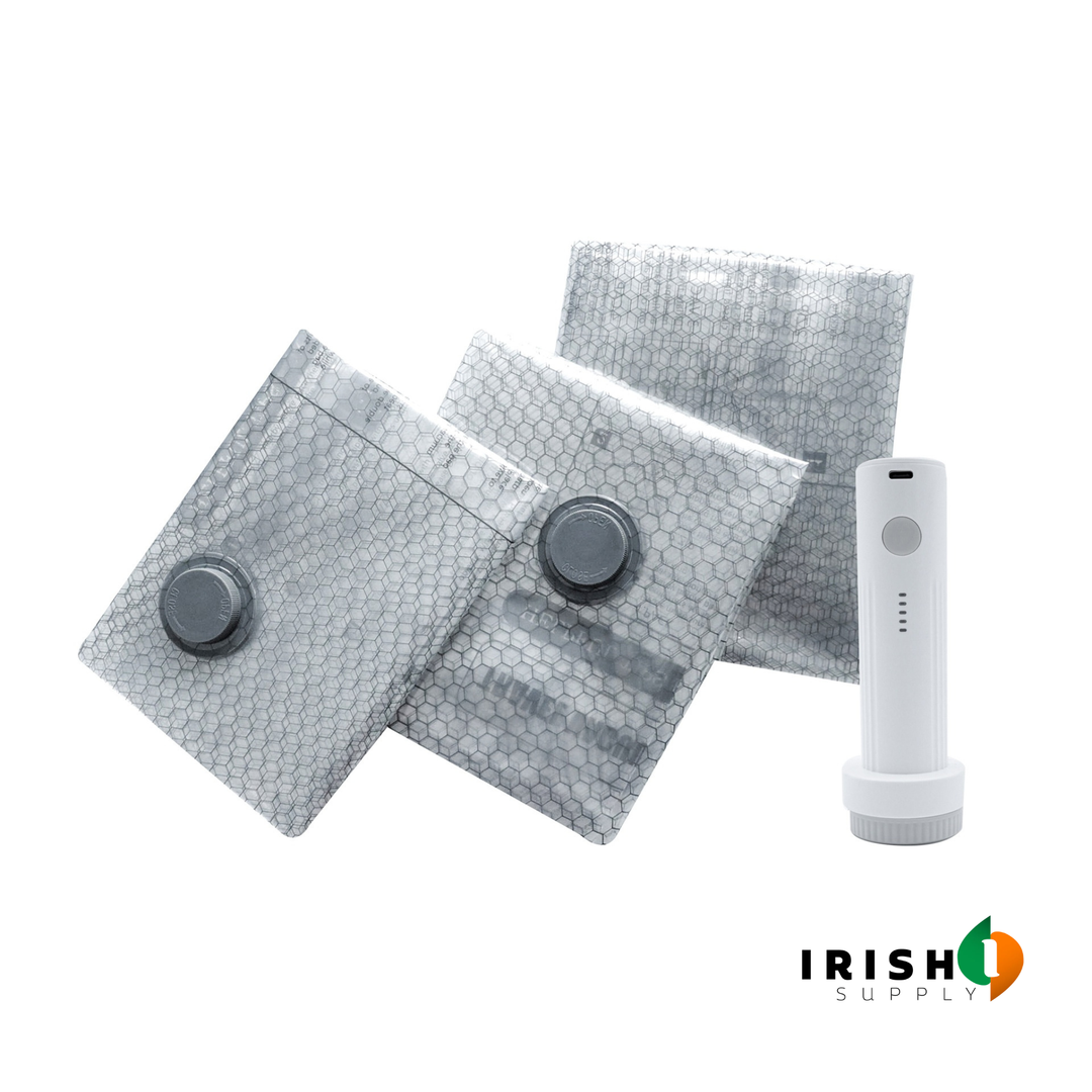 Three clear honeycomb-patterned compression bags with the white pump beside them.