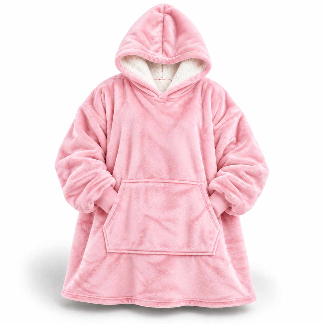 Pink oversized hoodie blanket shown from the front, with a white sherpa-lined hood, ribbed cuffs and a large front pocket.