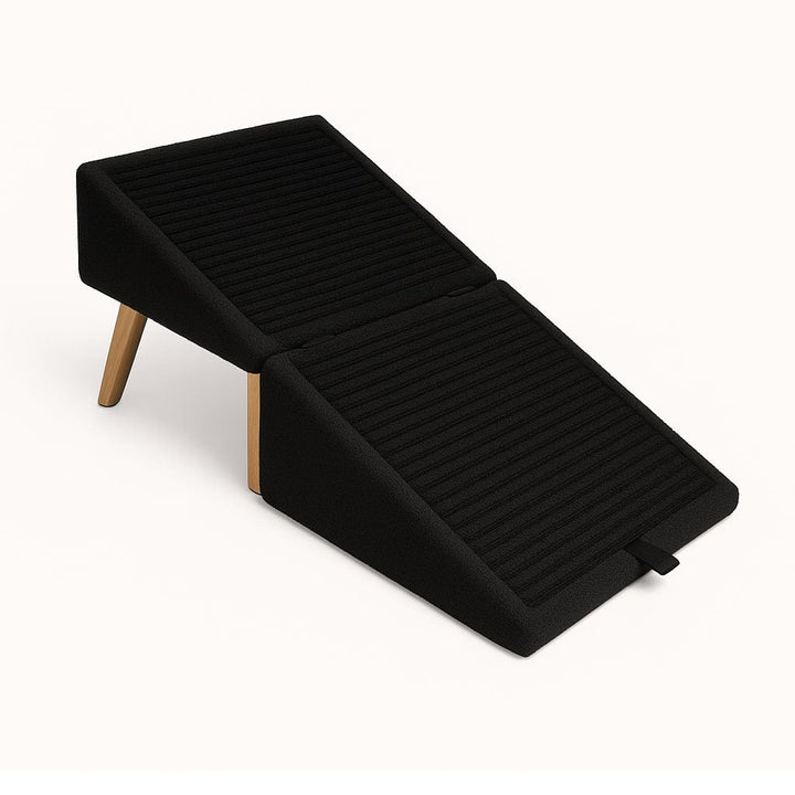 Black steps unfolded into a two-section ribbed ramp on wooden legs, shown from above against a plain white background. 4