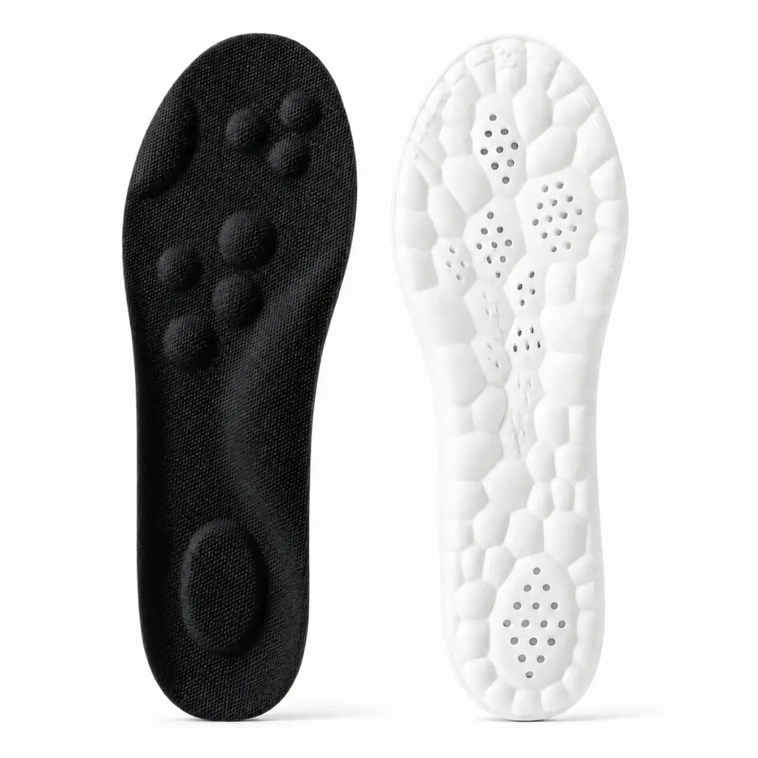 Black insole top with raised massage nodes and a white underside with a honeycomb cushion pattern and ventilation holes.