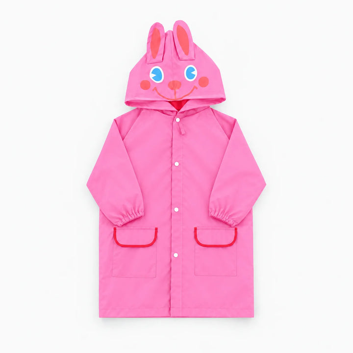 Pink raincoat with a smiling bunny-face hood and upright ears, red-trimmed pockets and snap front, shown flat. 9