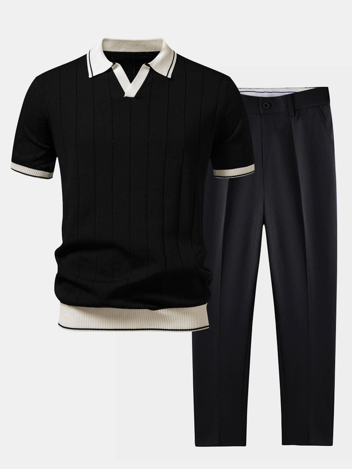 Flat lay of a black ribbed knit polo with cream contrast trim beside black tapered pants.