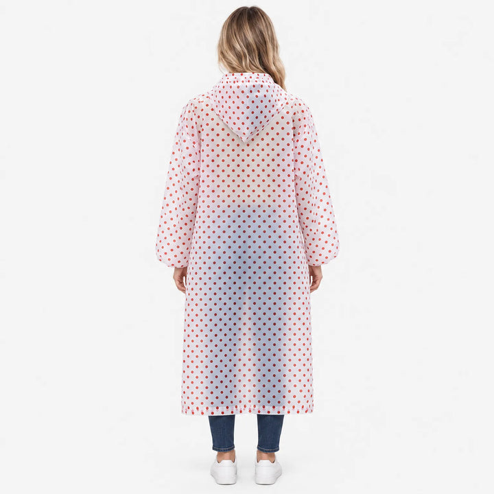 Back view of a woman in a translucent hooded raincoat with red polka dots and gathered, puffed sleeve cuffs. 4