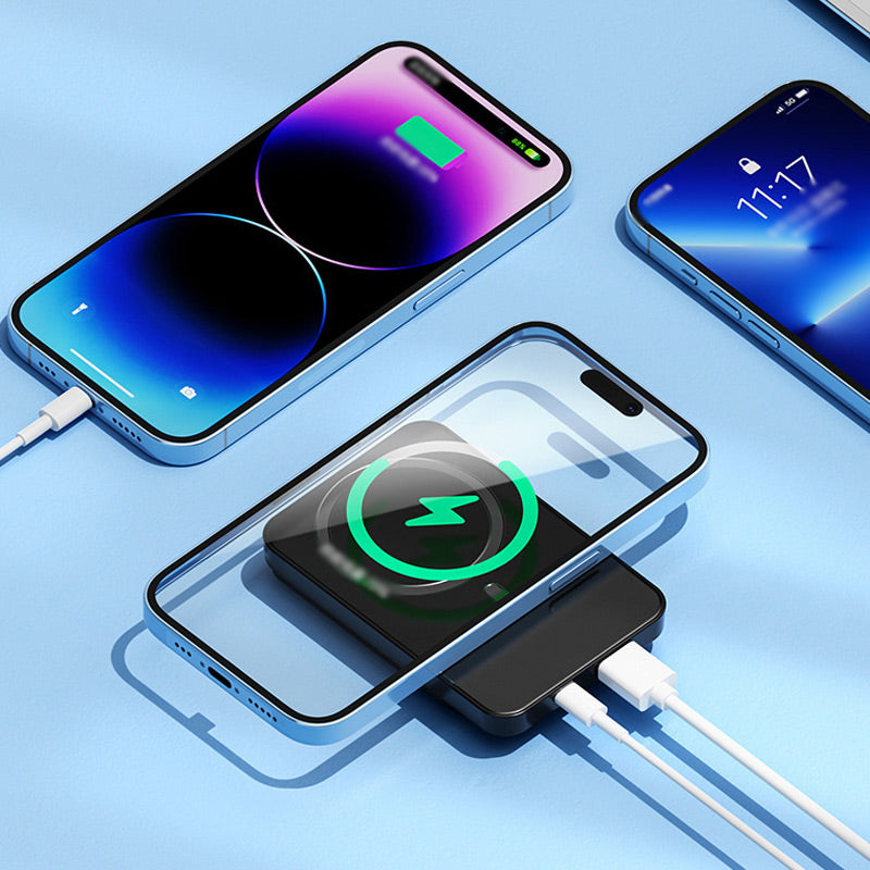 Black power bank wirelessly charging a phone placed on top of it, with two white cables charging other phones at the same time. 7