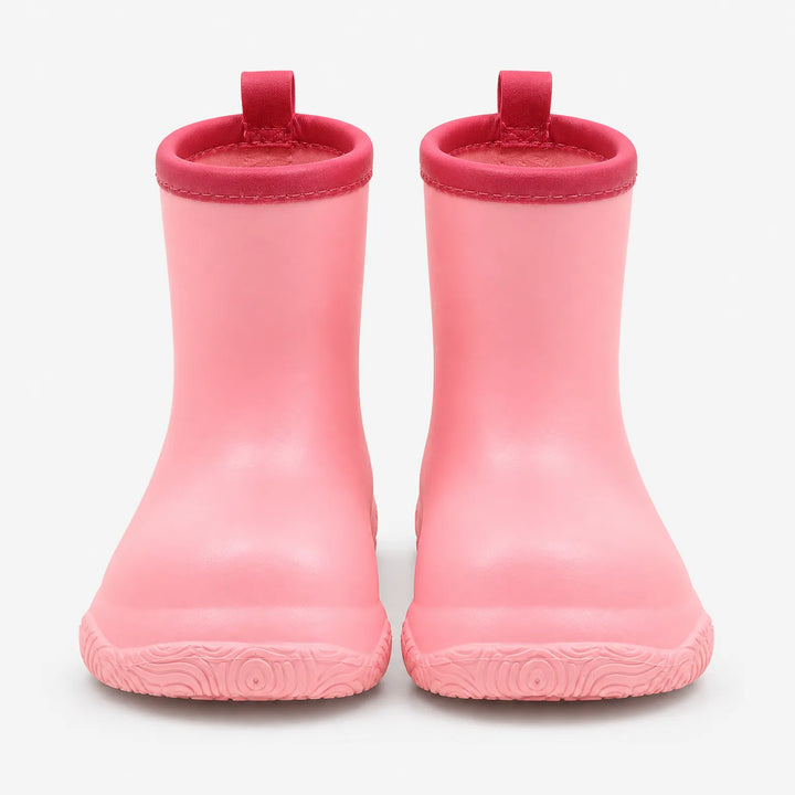 Front view of pink rain boots with deeper pink collars and loops, showing the patterned sole at the toe. 5