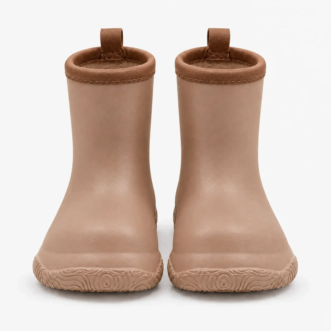 Front view of tan rain boots with brown collars and pull loops, showing the swirl-patterned soles. 8