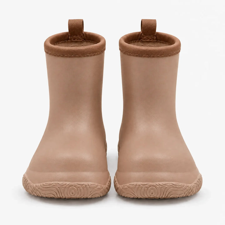Front view of tan rain boots with brown collars and pull loops, showing the swirl-patterned soles. 8