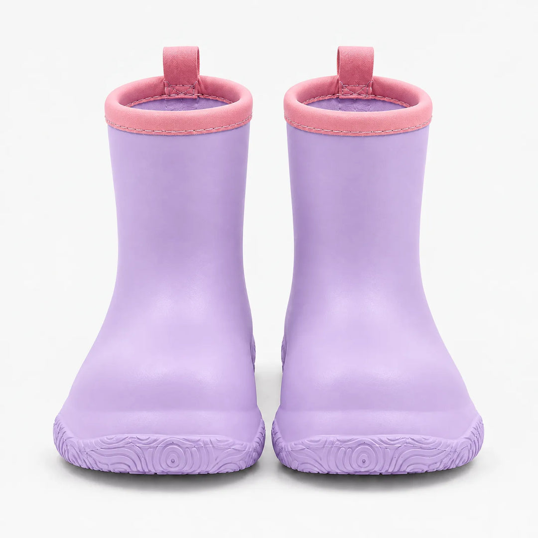 Front view of lilac rain boots with pink collars and pull loops, showing the swirl-patterned soles. 9