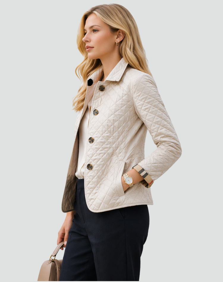 Cream quilted jacket detail showing diamond stitching, buttons, front pocket and checked cuff.