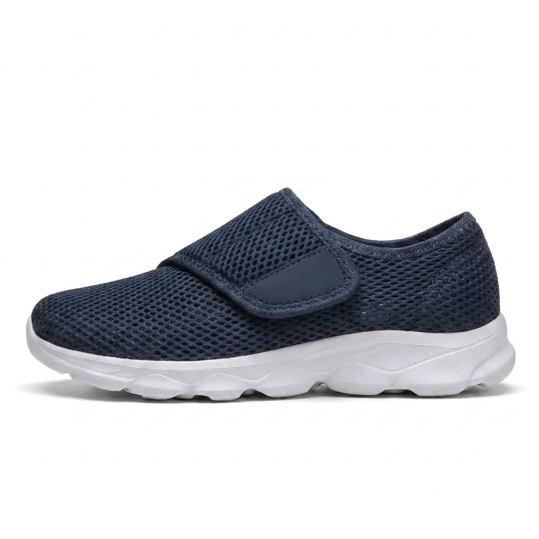 Side view of a navy mesh walking shoe with a white sole and one wide hook-and-loop strap 1
