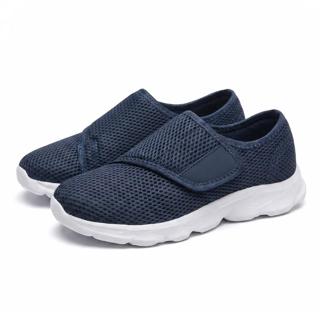 Pair of navy mesh shoes with white soles and hook-and-loop straps, shown at an angle 7