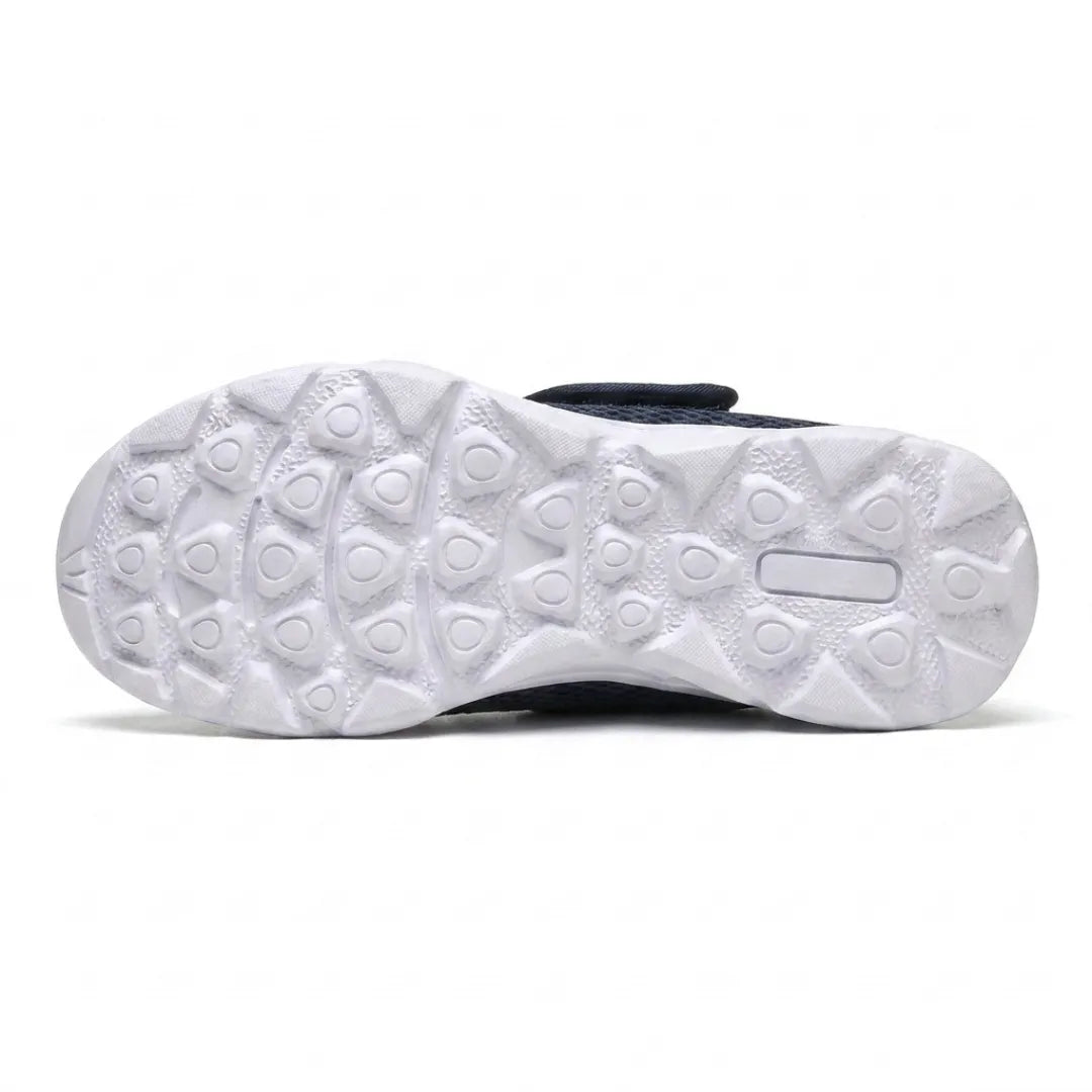 Underside of the white sole showing the pattern of rounded tread lugs for grip 9