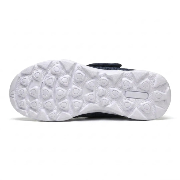 Underside of the white sole showing the pattern of rounded tread lugs for grip 9