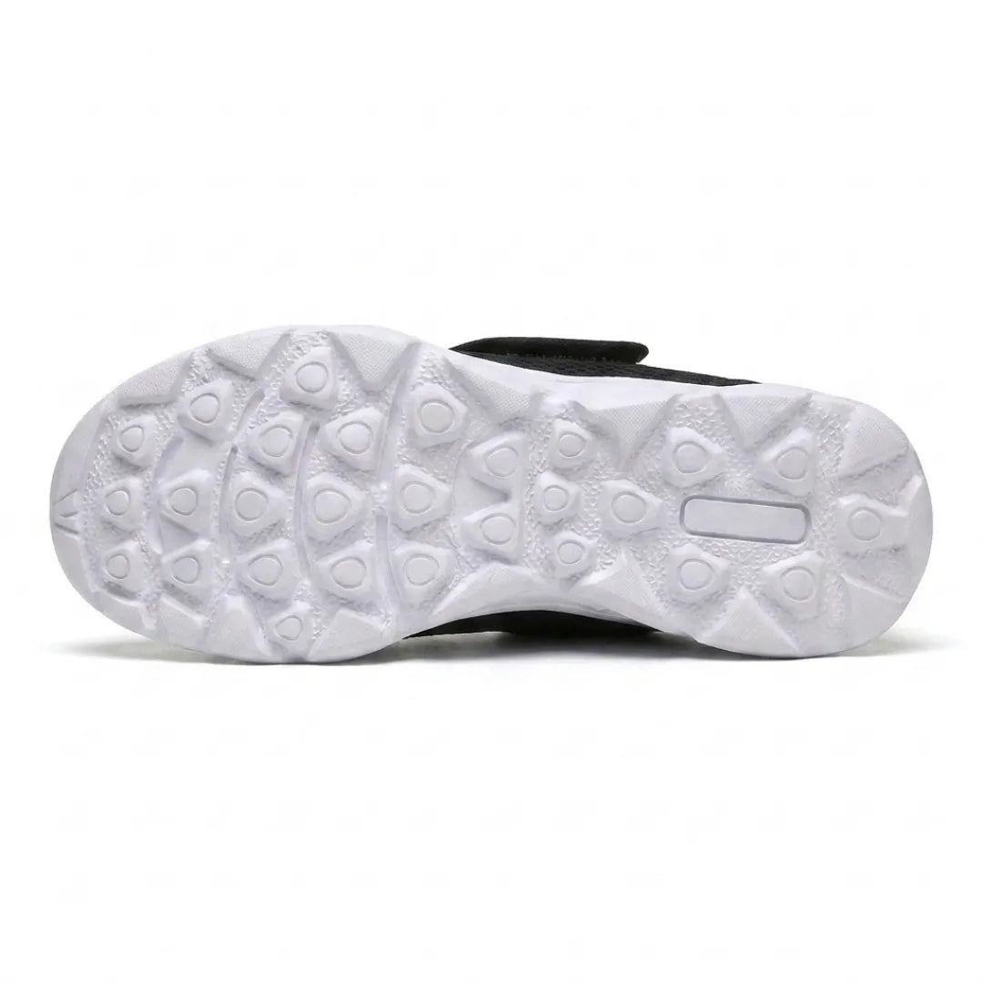 Underside of the white sole showing a pattern of rounded triangular treads for grip 27