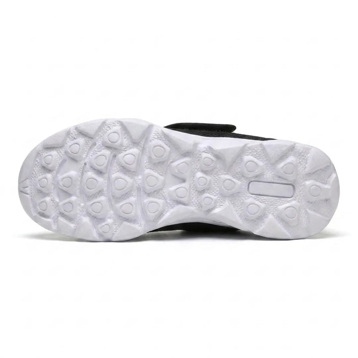 Underside of the white sole showing a pattern of rounded triangular treads for grip 27