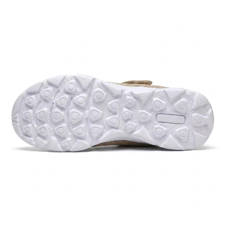 Underside of the white sole on the beige pair, showing the rounded triangular tread pattern 36