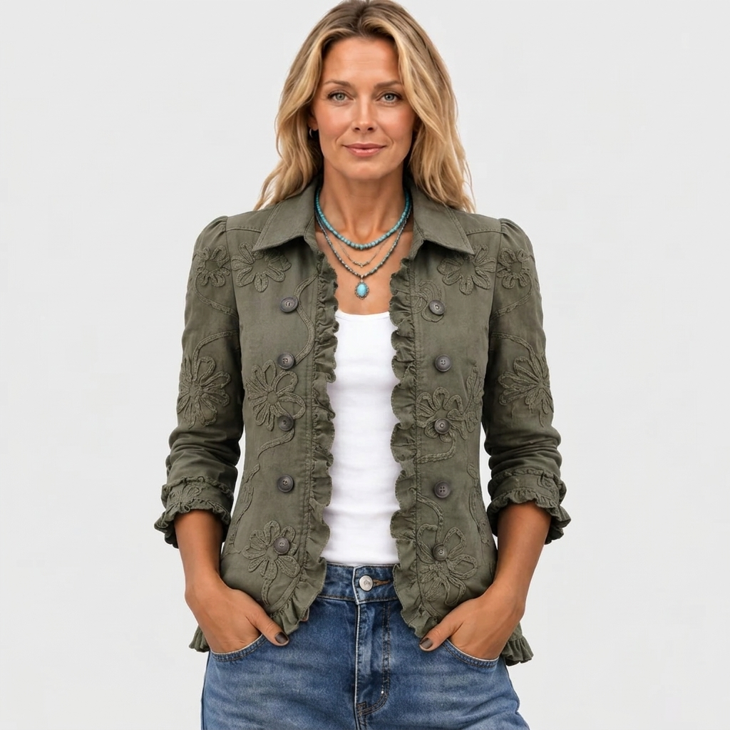 Olive green jacket worn open over a white top with hands in jeans pockets.