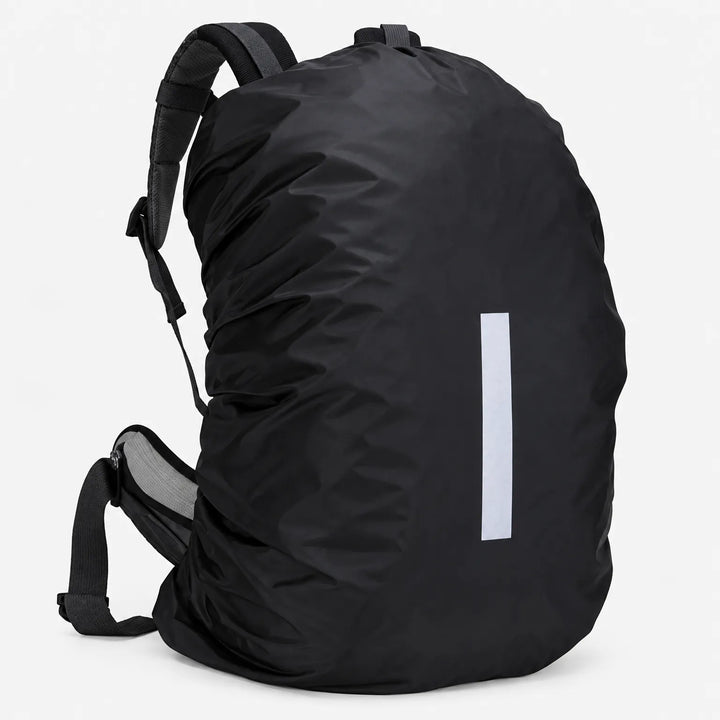 Three-quarter side view of a backpack wrapped in the black cover, showing the shoulder straps, hip belt and reflective strip. 4