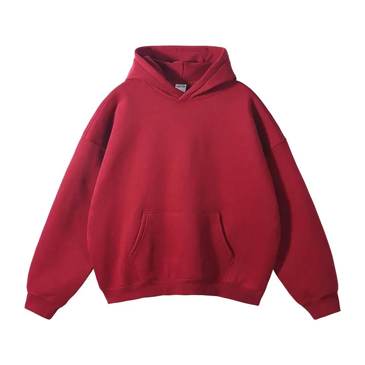 Front view of the hoodie in deep red, laid flat, showing the hood, kangaroo pocket and ribbed cuffs.