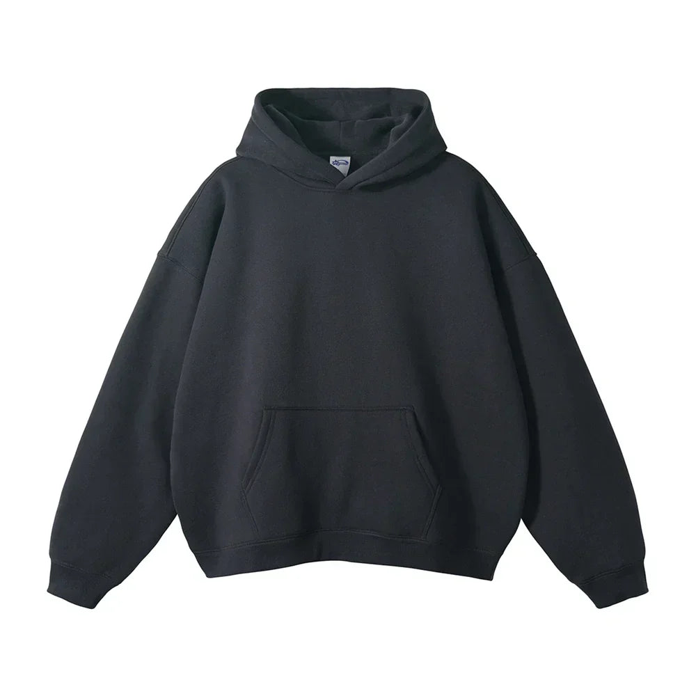 Front view of the relaxed pullover hoodie in charcoal black, flat on white, showing the kangaroo pocket and ribbed cuffs.