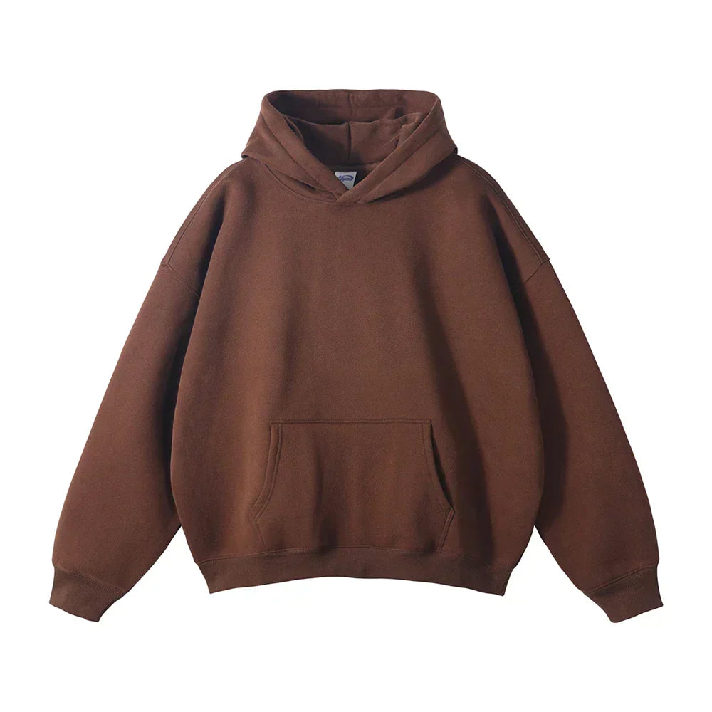 Front view of the hoodie in chocolate brown, laid flat, with the kangaroo pocket, ribbed cuffs and loose hood.