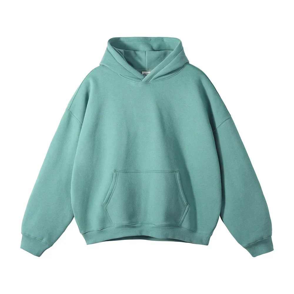 Front view of the hoodie in teal green, laid flat, showing the hood, kangaroo pocket and ribbed cuffs.
