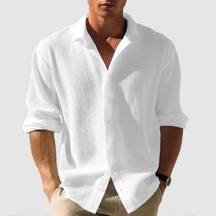 Man wearing the textured shirt in bright white, sleeves rolled, hands in khaki pants pockets 2
