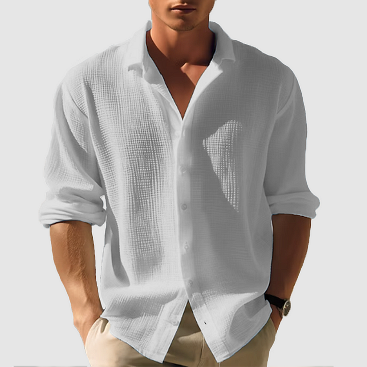 Man wearing the textured shirt in light gray, sleeves rolled, hands in khaki pants pockets 6
