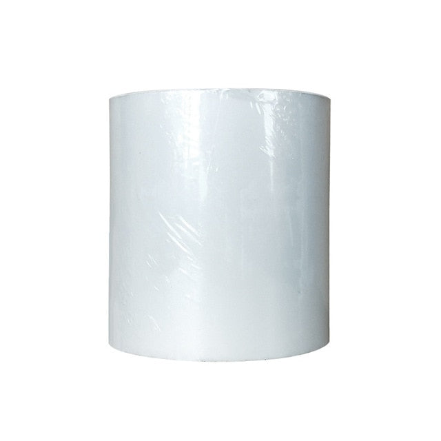 Roll of tape wrapped in white film, standing upright on a white background.
