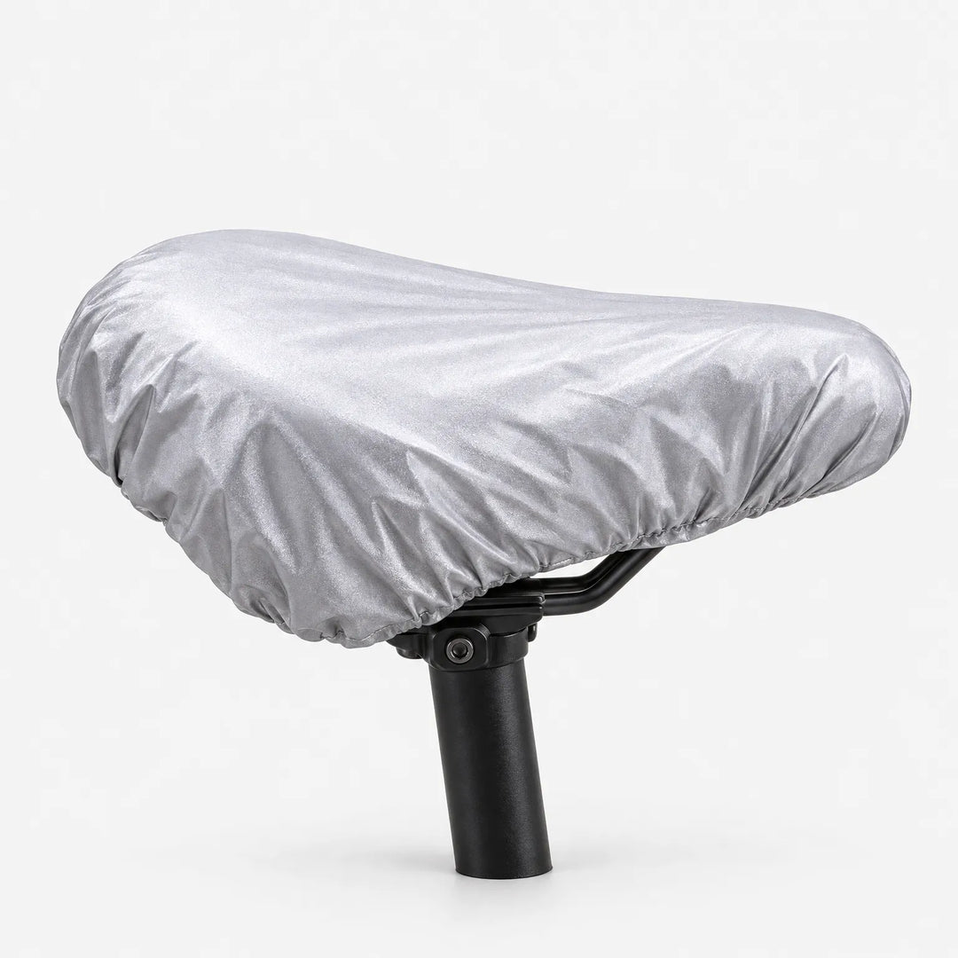 Reversed silver-gray side of the cover, gathered with an elastic edge and fitted over a saddle on a seatpost. 4