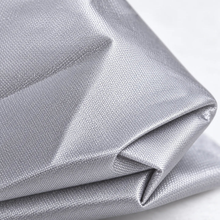 Extreme close-up of the silver-gray woven fabric folded over itself, showing its fine weave and slight sheen. 5