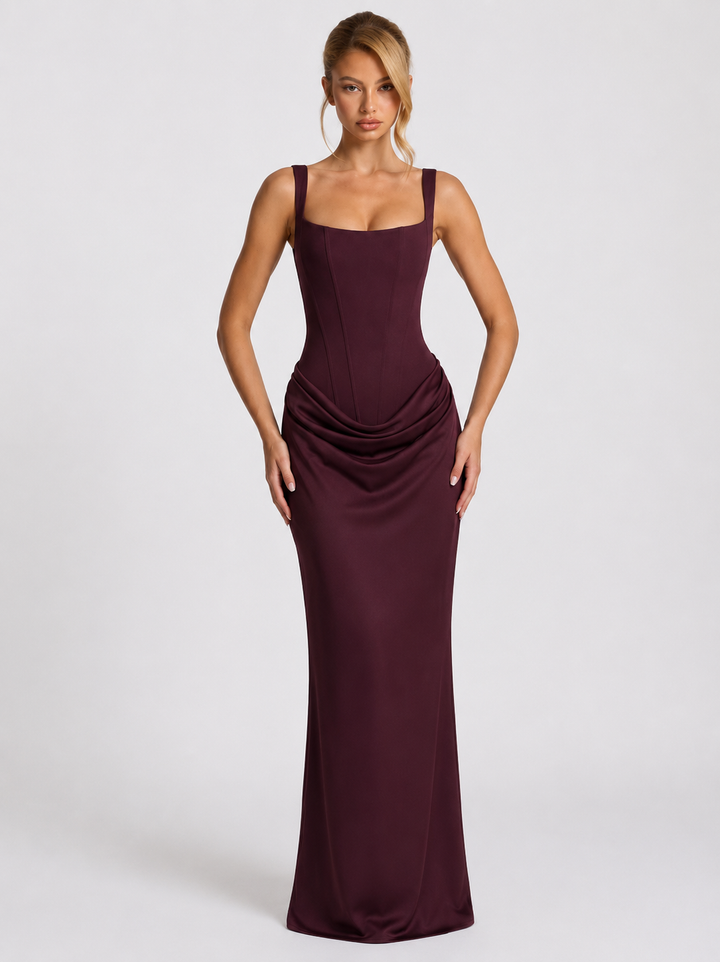 Plum maxi dress front view with a full drape and long skirt.