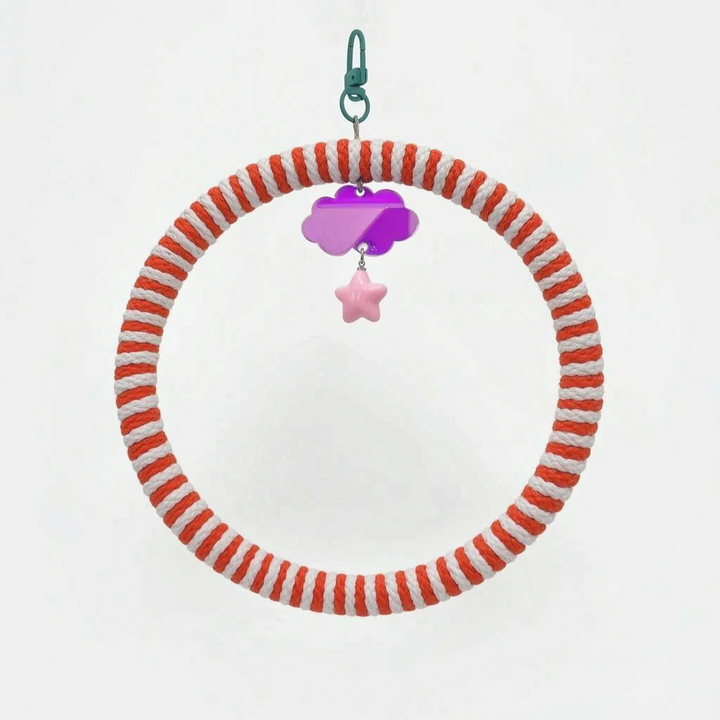 Ring swing with red-orange and white striped rope, a teal clasp, a purple mirrored cloud charm and a pink star bead. 6